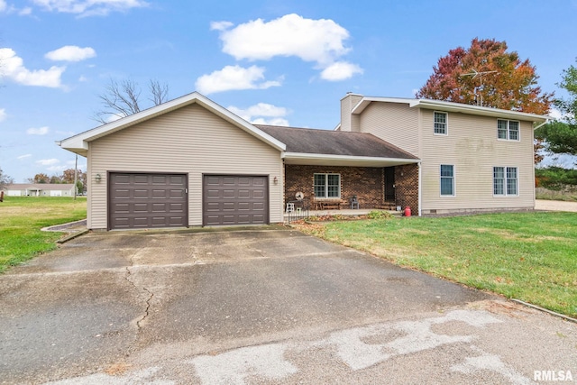 view of front facade featuring a garage, a front lawn, and a porch