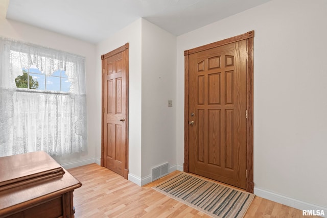 foyer with light wood-type flooring