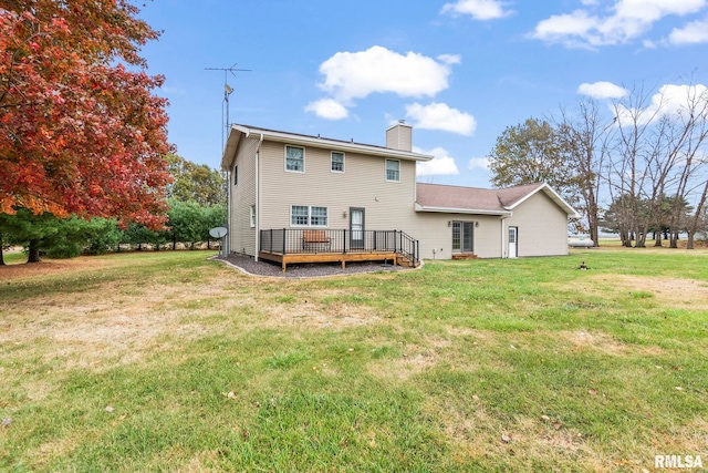 back of property featuring a deck and a lawn