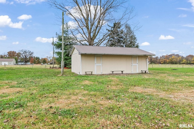 view of outdoor structure featuring a yard