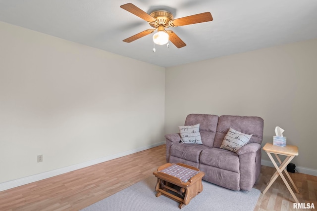 living room featuring light wood-type flooring and ceiling fan