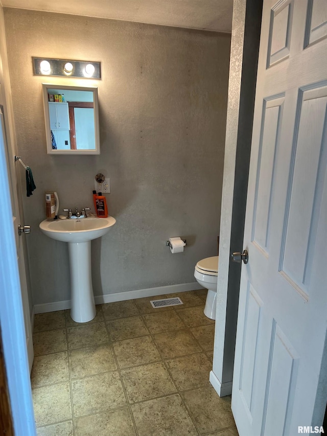 321 N County Road 1200, West Point, IL 62380 - bathroom with toilet and baseboards
