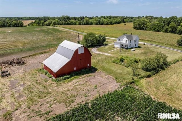 birds eye view of property featuring a rural view