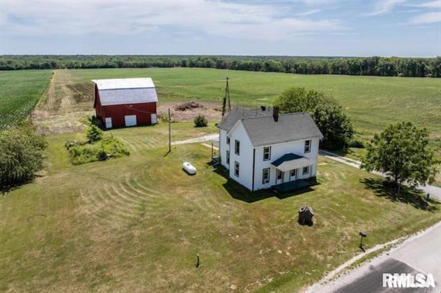 birds eye view of property with a rural view