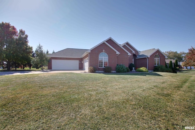 view of front of house with a garage and a front lawn