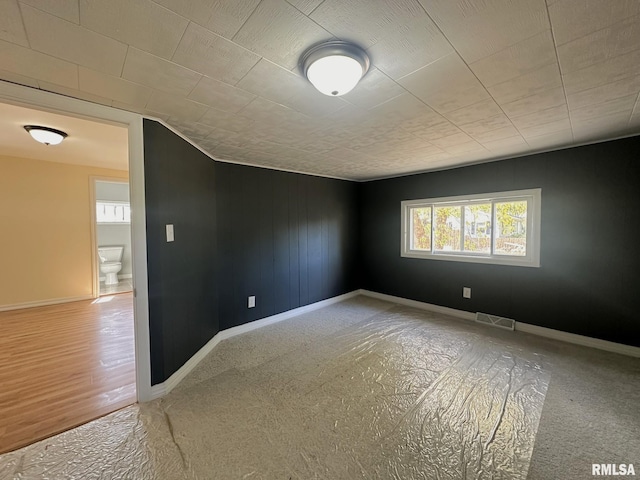 spare room featuring hardwood / wood-style floors