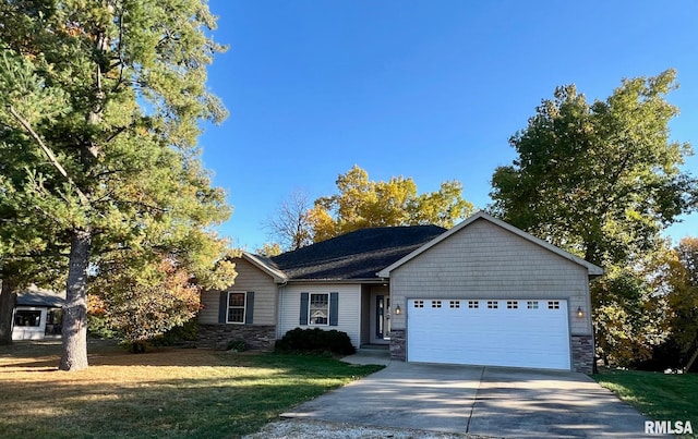 ranch-style home with a front lawn and a garage