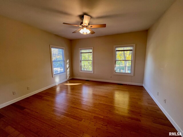 unfurnished room featuring ceiling fan and wood-type flooring