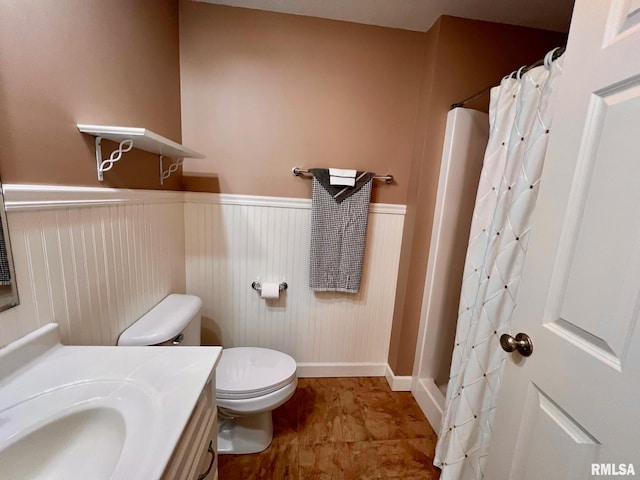 bathroom with vanity, a shower with curtain, and toilet