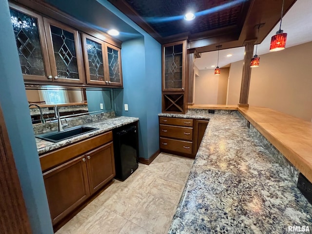 bar featuring dishwasher, sink, light stone countertops, and decorative light fixtures