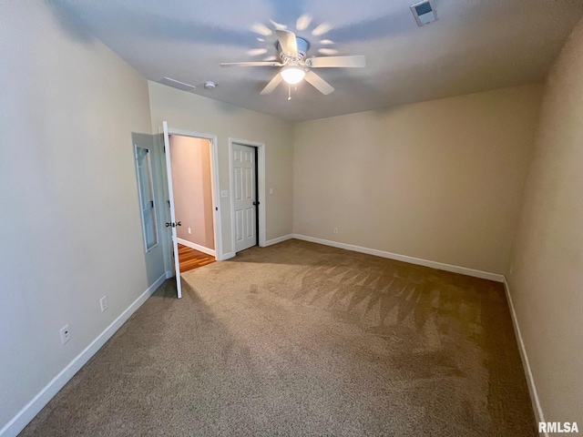 unfurnished bedroom with carpet flooring and ceiling fan