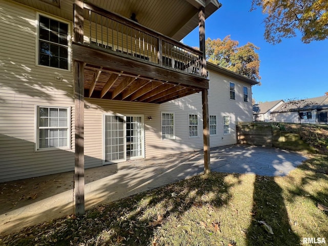 view of home's exterior featuring a patio and a lawn