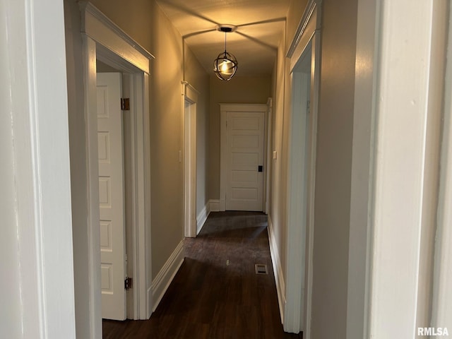 hall with dark hardwood / wood-style floors