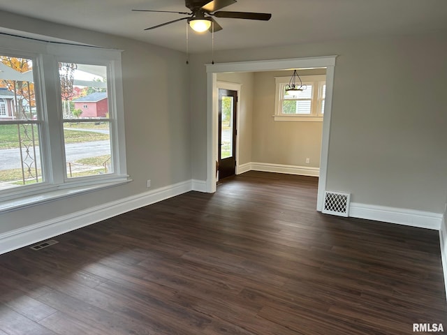 unfurnished room featuring dark hardwood / wood-style floors and ceiling fan