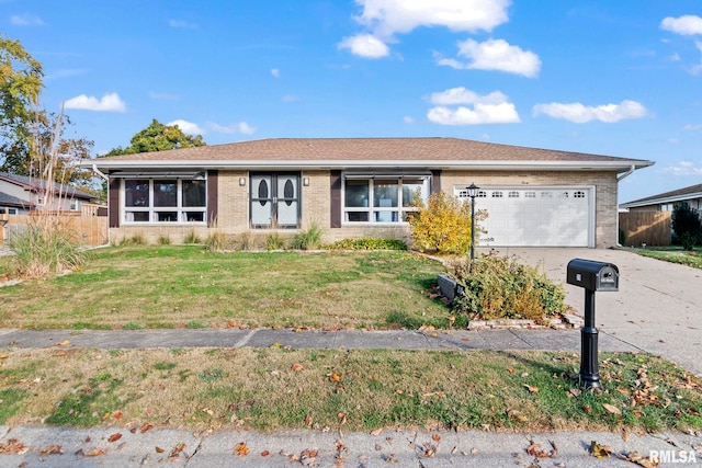 ranch-style home with a front lawn and a garage