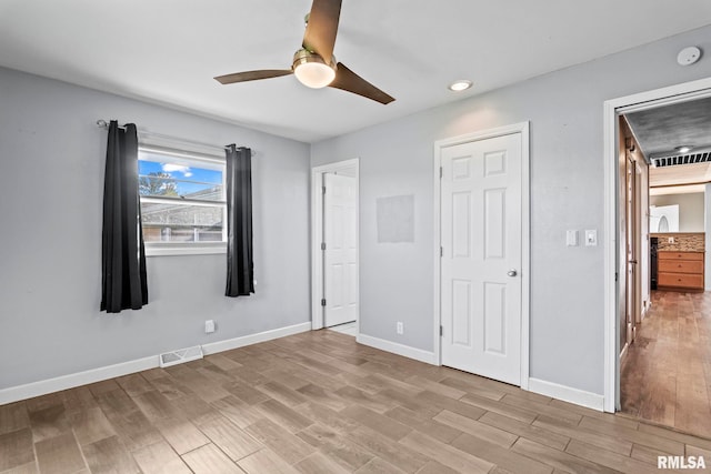 unfurnished bedroom featuring light hardwood / wood-style flooring and ceiling fan