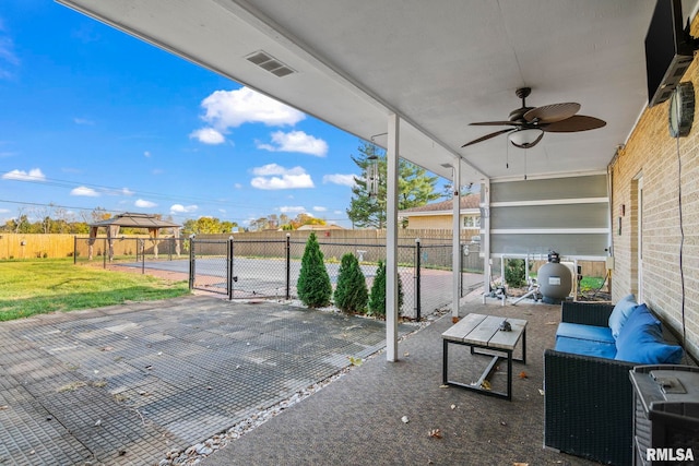 view of patio / terrace with ceiling fan and outdoor lounge area