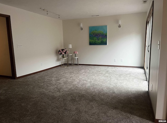 77 Country Pl Unit 77, Springfield, IL 62703 - carpeted spare room featuring baseboards and rail lighting