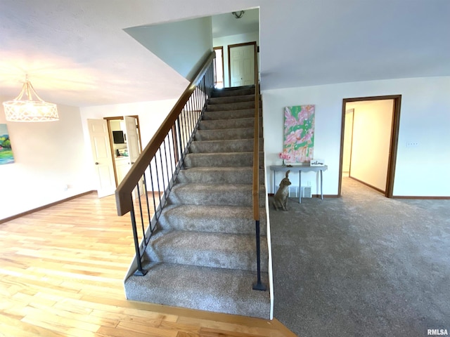 foyer entrance with dark tile patterned flooring and a textured ceiling