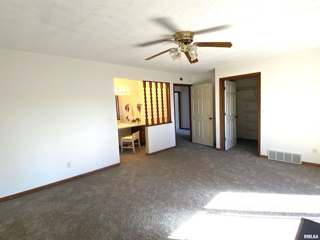 77 Country Pl Unit 77, Springfield, IL 62703 - unfurnished bedroom featuring carpet, a ceiling fan, and a textured ceiling