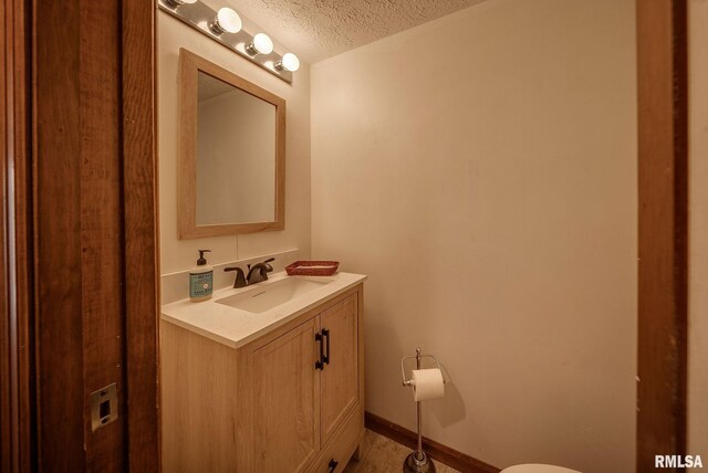 77 Country Pl Unit 77, Springfield, IL 62703 - bathroom featuring a textured ceiling and vanity