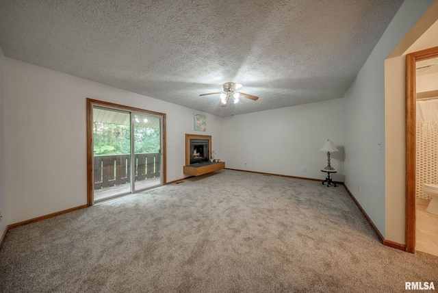 77 Country Pl Unit 77, Springfield, IL 62703 - unfurnished living room with carpet, ceiling fan, a fireplace with raised hearth, and a textured ceiling