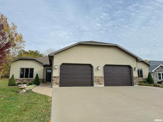 view of front of home with a front lawn and a garage