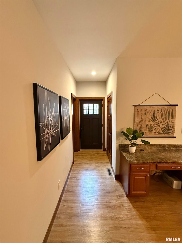 entryway with light hardwood / wood-style floors