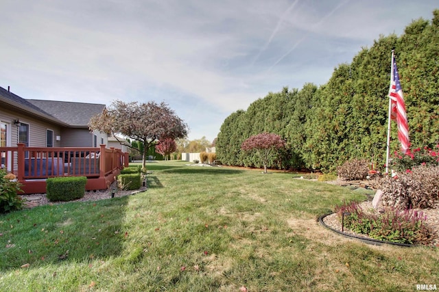 view of yard with a wooden deck