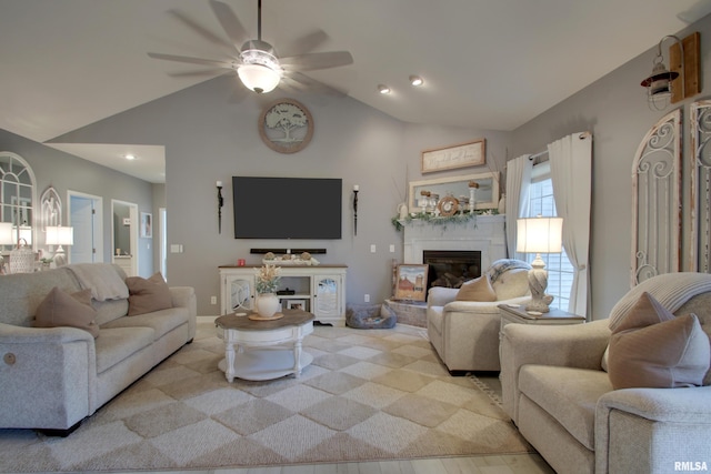 living room with ceiling fan and lofted ceiling