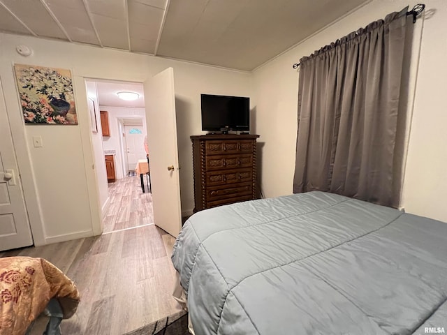 bedroom with light wood-type flooring