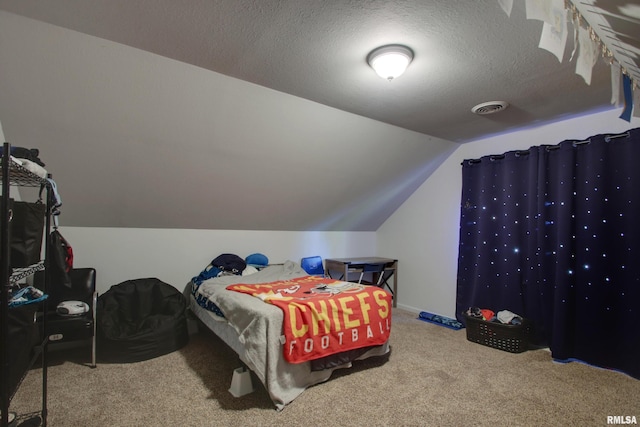 bedroom featuring carpet floors, a textured ceiling, and vaulted ceiling