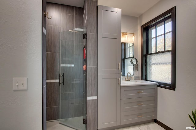 bathroom with vanity and an enclosed shower