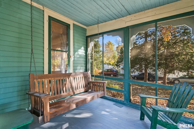 sunroom / solarium with wood ceiling