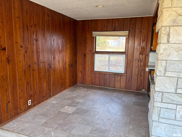 spare room with wooden walls