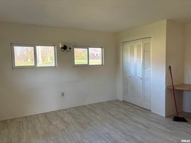 unfurnished bedroom with a closet