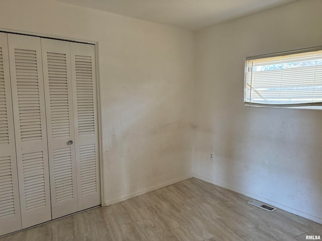 unfurnished bedroom with a closet