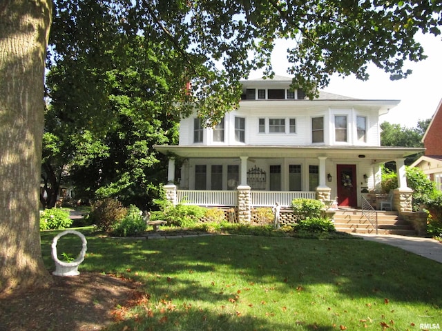 view of front facade with a front lawn and covered porch