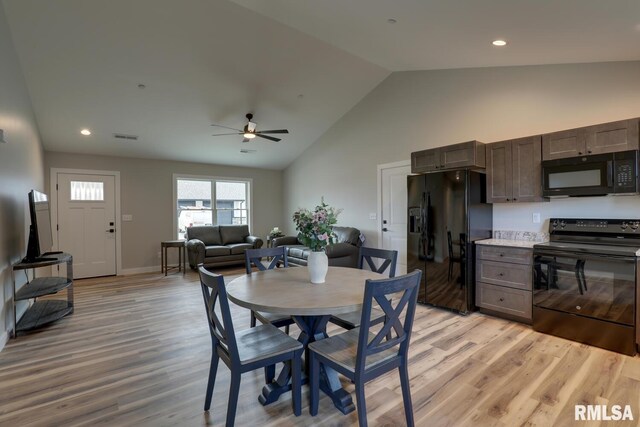 interior space with high vaulted ceiling and light colored carpet