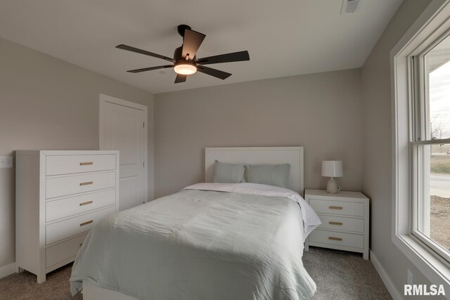 empty room with light carpet, lofted ceiling, and plenty of natural light