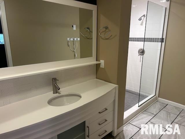 bathroom featuring walk in shower and vanity