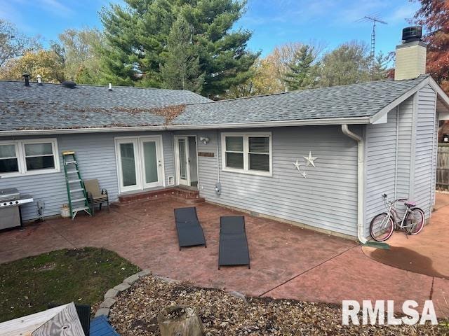 back of house with a patio