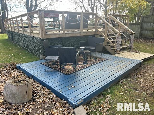 wooden deck with an outdoor living space