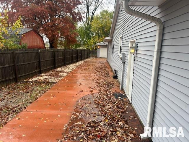 exterior space with an outbuilding and a garage