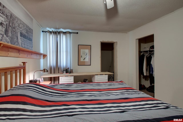 1340 Mulholland St, Nauvoo, IL 62354 - bedroom with ornamental molding, a textured ceiling, and a closet
