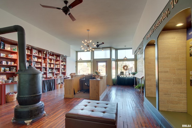1340 Mulholland St, Nauvoo, IL 62354 - office area with a wood stove, hardwood / wood-style flooring, a ceiling fan, and arched walkways
