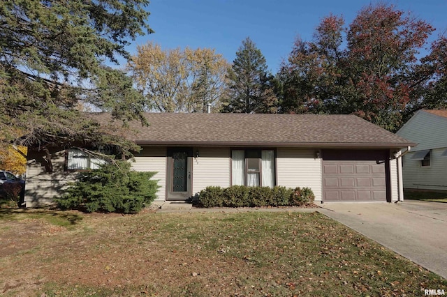 single story home featuring a garage and a front yard