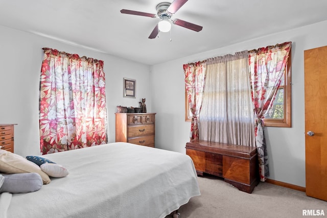 bedroom featuring ceiling fan and light colored carpet