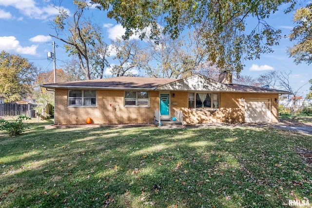 single story home with a front yard, brick siding, an attached garage, and driveway