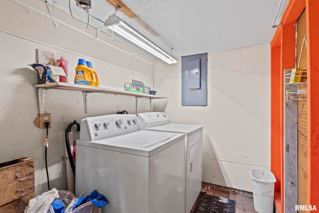 laundry area with electric panel, laundry area, and separate washer and dryer